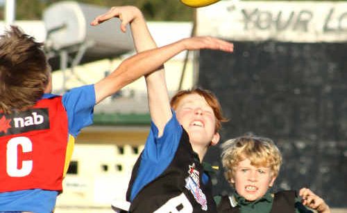 Juniors take a leap in Emerald during the AusKick coaching clinics. Juniors take a leap in Emerald during the AusKick coaching clinics.